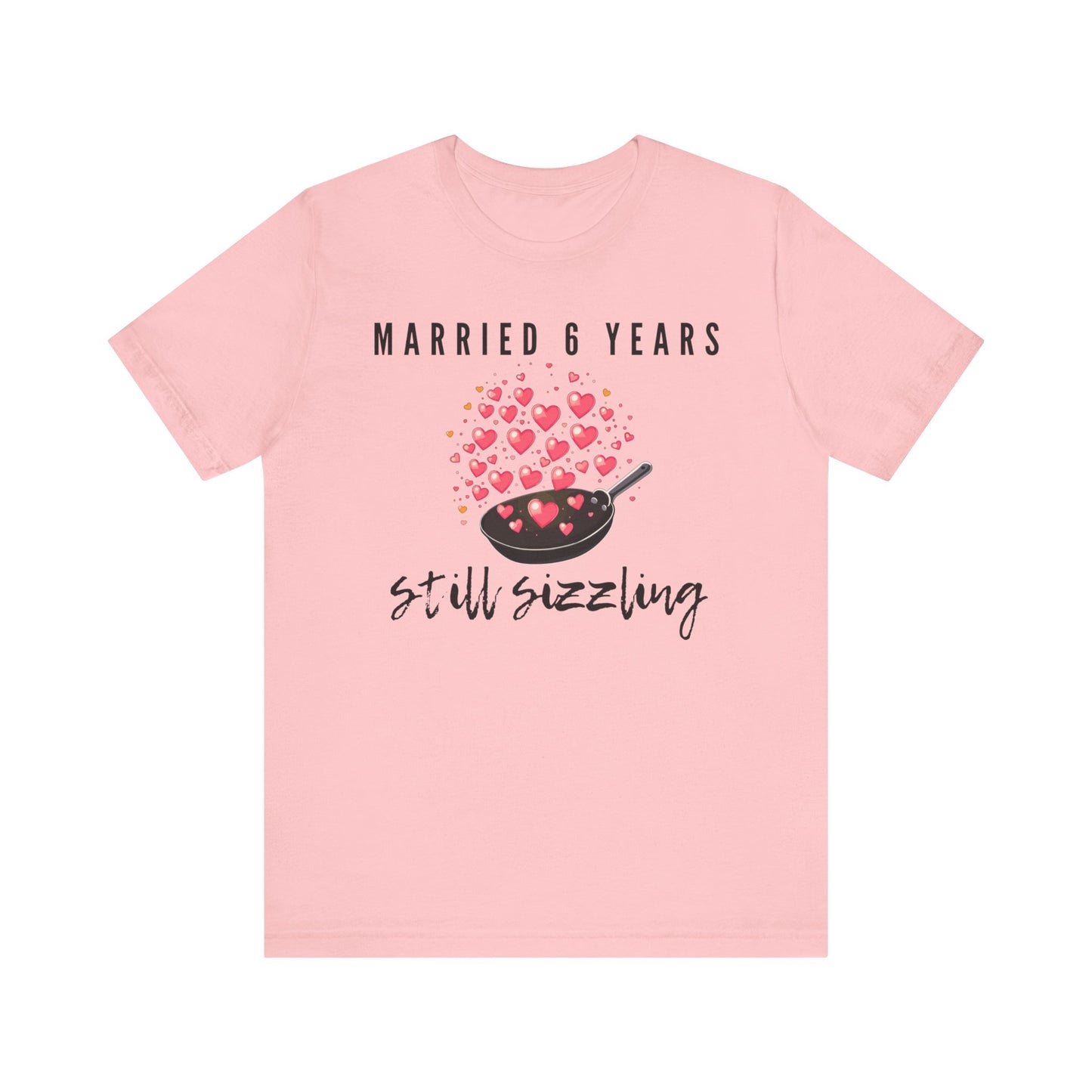 Pink anniversary t-shirt with the text Married 6 Years Still Sizzling around a cartoon frying pan and hearts