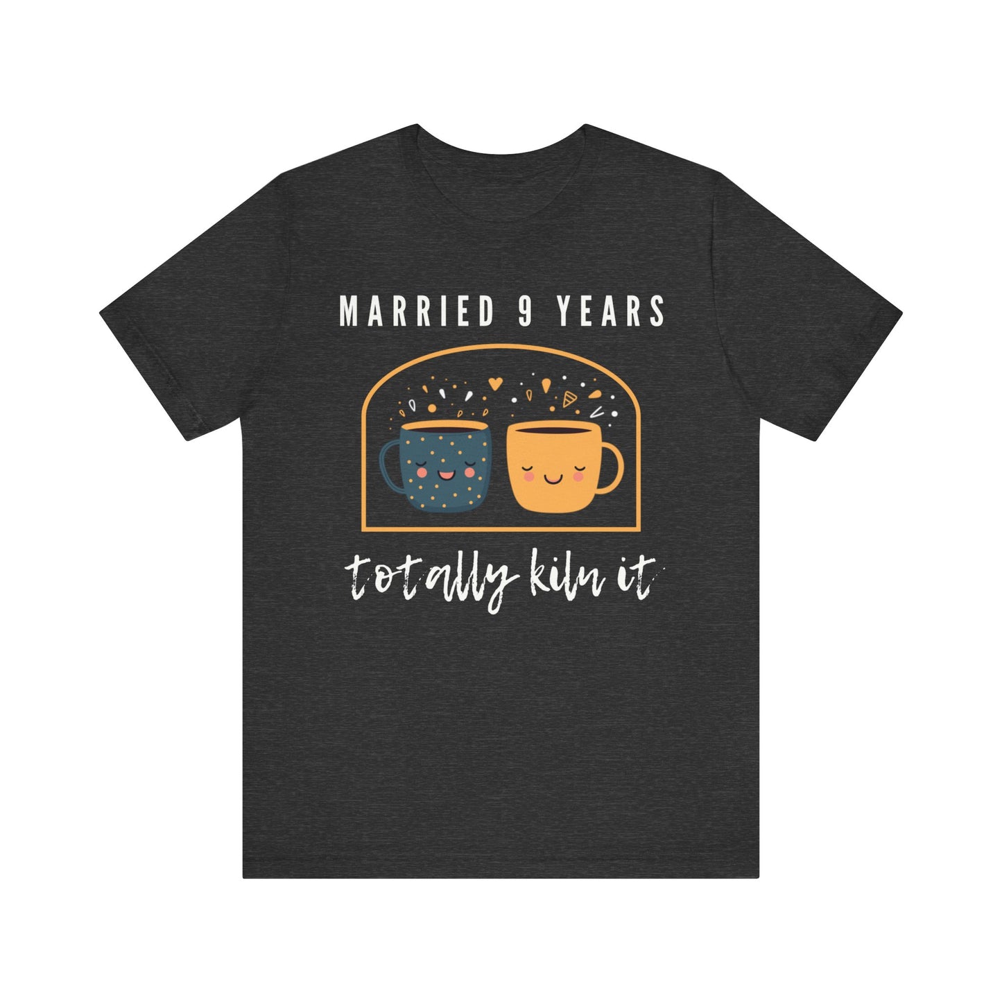 Grey anniversary t-shirt with the text Married 9 Years Totally Kiln It around two cartoon cups in a pottery kiln