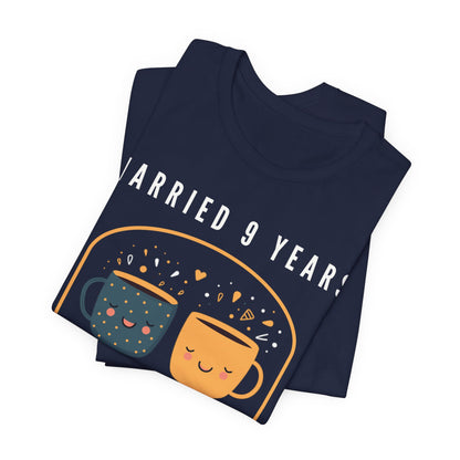 Navy anniversary t-shirt with the text Married 9 Years Totally Kiln It around two cartoon cups in a pottery kiln