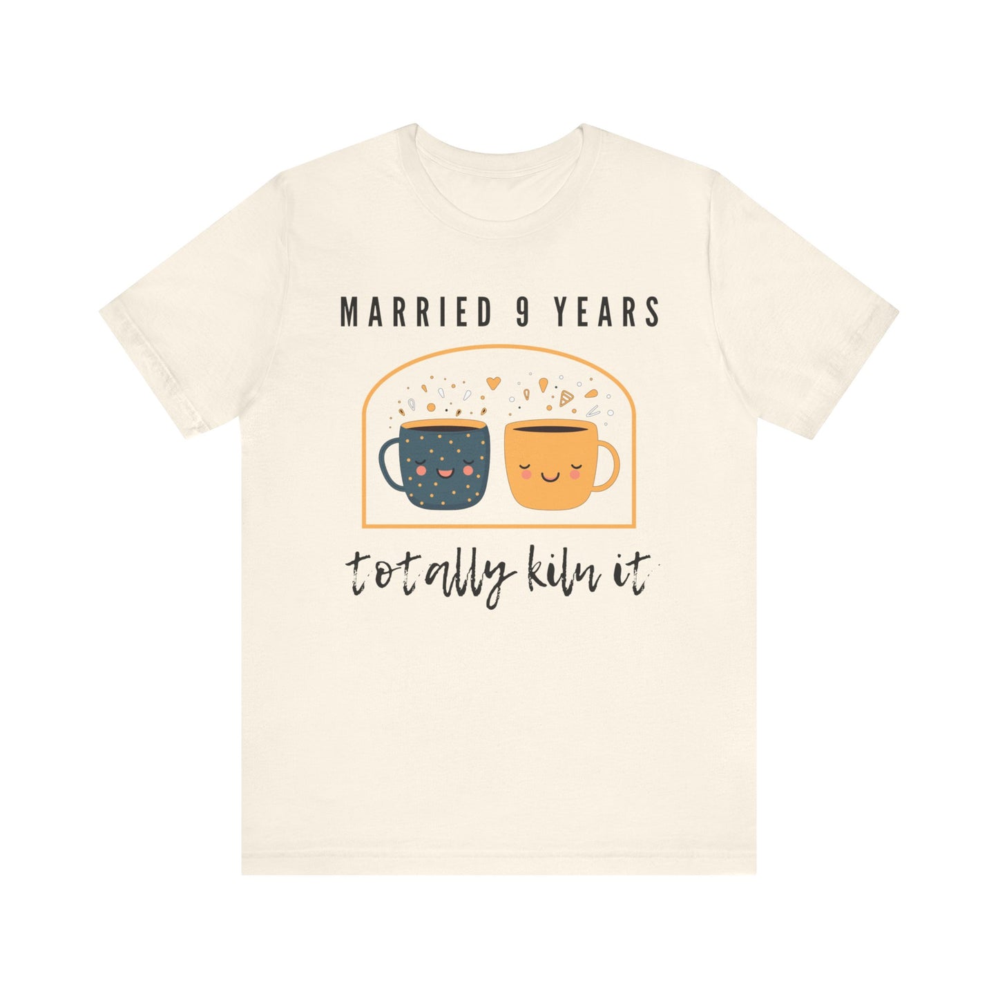 Natural anniversary t-shirt with the text Married 9 Years Totally Kiln It around two cartoon cups in a pottery kiln