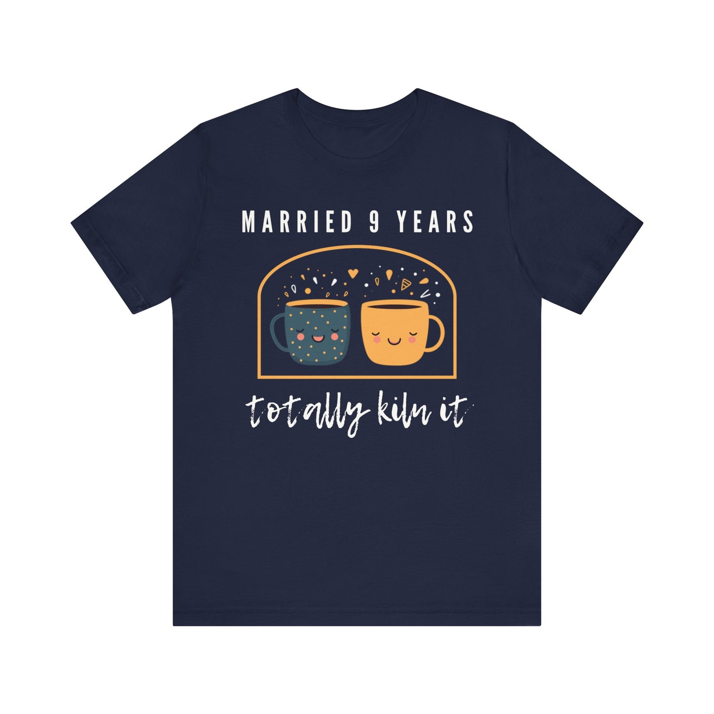 Navy anniversary t-shirt with the text Married 9 Years Totally Kiln It around two cartoon cups in a pottery kiln