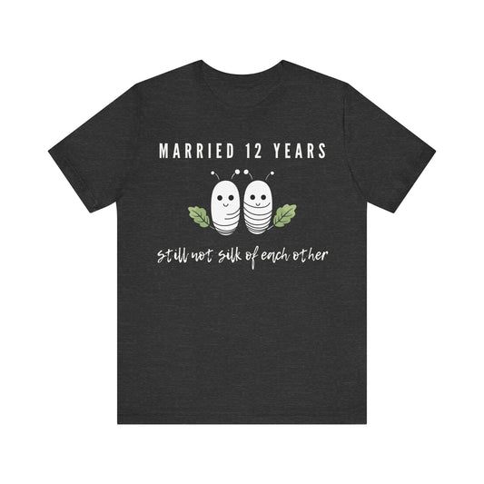 Dark grey anniversary T-shirt with the text Married 12 Years Still Not Silk Of Each Other around two cartoon silkworms