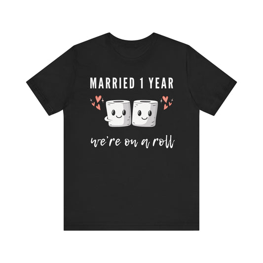 Black anniversary t-shirt with the text Married 1 Year We’re on a Roll around two cartoon toilet paper rolls