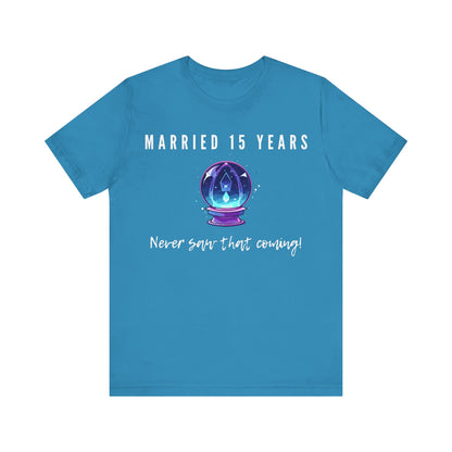 Aqua anniversary T-shirt with the text Married 15 Years Never Saw That Coming around a cartoon crystal ball