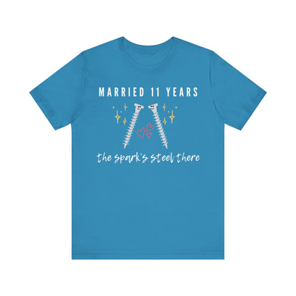 Aqua anniversary t-shirt with the text Married 11 Years The Spark’s Steel There around two cartoon screws