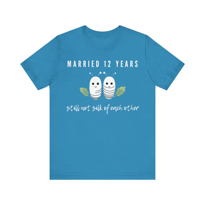 Aqua anniversary T-shirt with the text Married 12 Years Still Not Silk Of Each Other around two cartoon silkworms